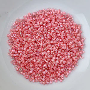 11/0 Delica - Coral Lined Crystal Luster DB0070 - The Bead N Crystal & Enclave Gems