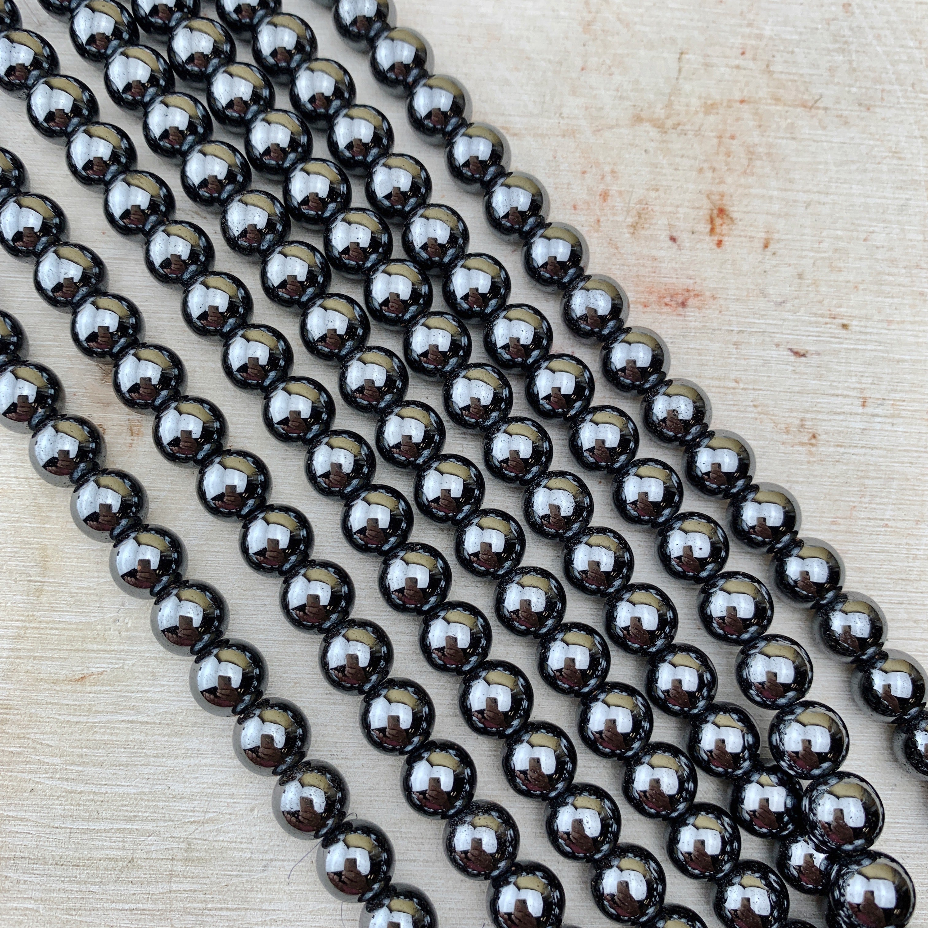 Synthetic Hematite Electroplated Blue 5x8mm Moon Beads - 8 inch strand